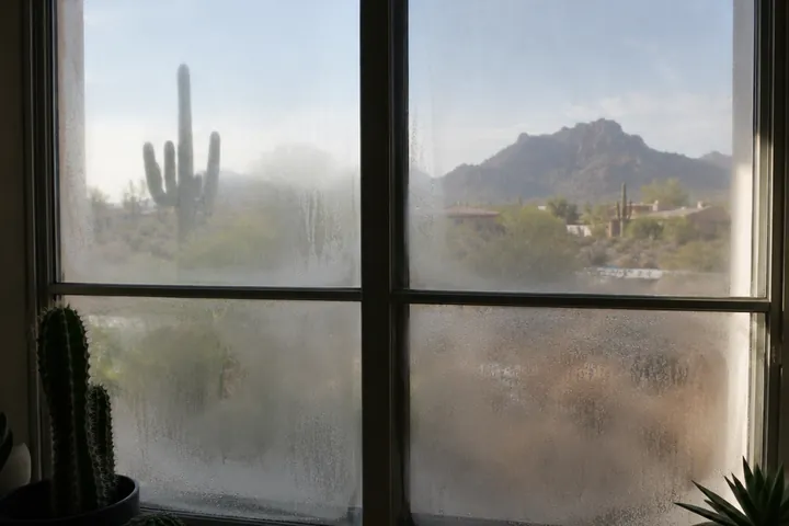 Fogged window glass with haze between the panes