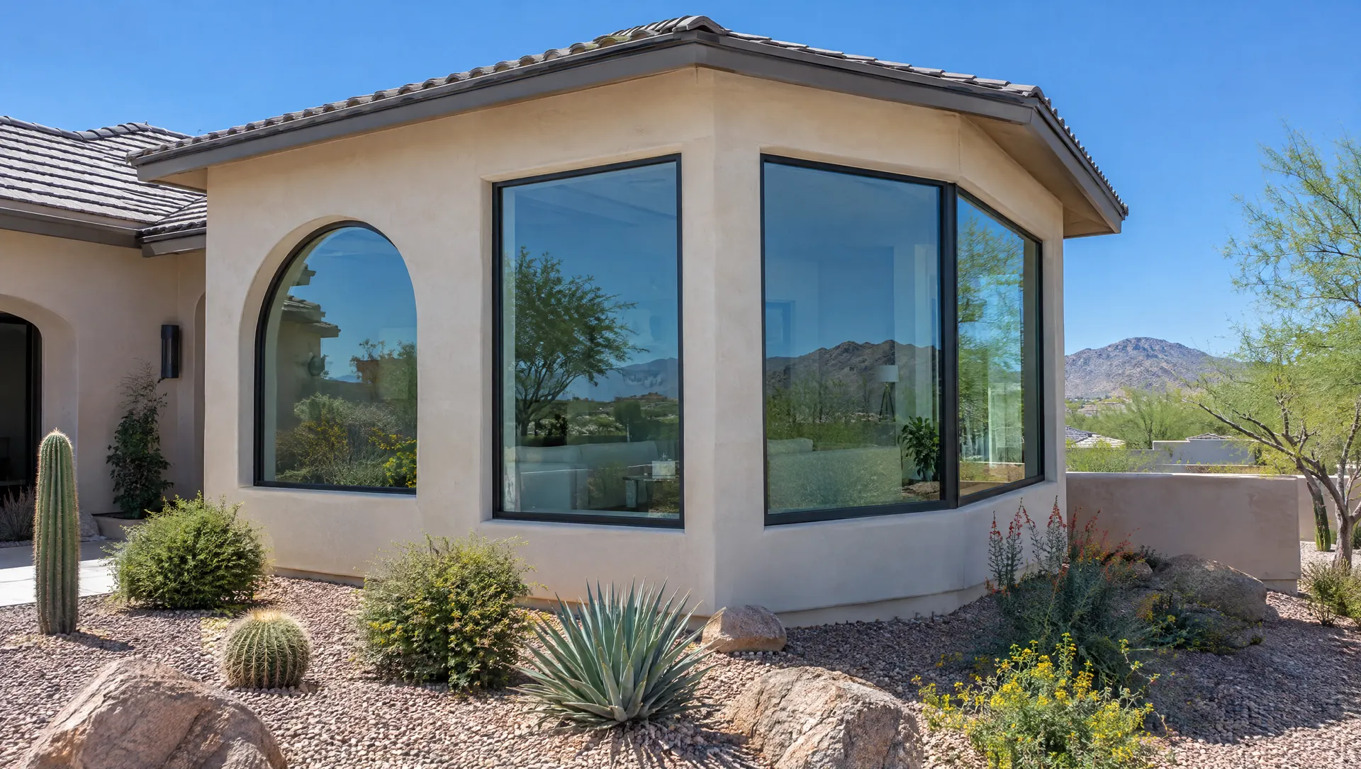 Phoenix home addition with an arched window, tall picture window and corner window