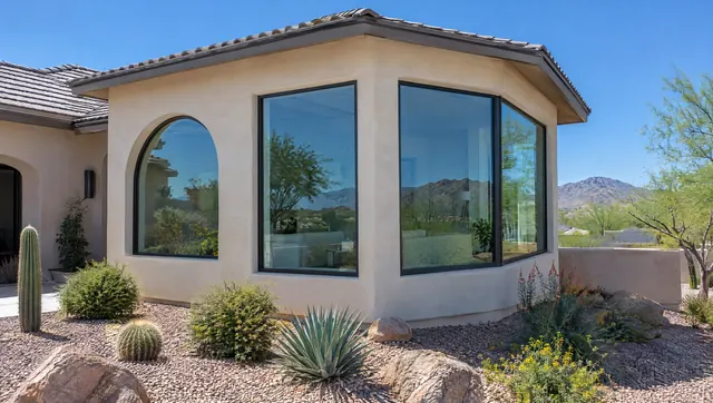 Phoenix home addition with an arched window, tall picture window and corner window